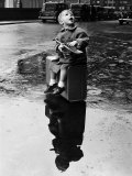 Little Boy Sits on His Suitcase Waiting for a Train to Take Him to the Seaside
