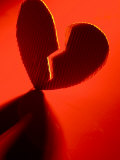 Cardboard Broken Heart in Red Light