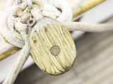 Wooden Pulley and Rope on Edge of Boat