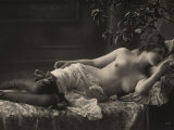 A Barebreasted Young Woman Lying Down, Wearing Shoes and Lingerie
