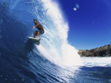 Wave Curling Up Over Surfer