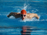 Young Man Swimming The Butterfly Stroke