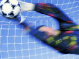 Goalie Attempting to Stop a Soccer Ball