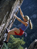 Young Woman Rock Climbing