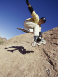 Teen Boy in Off Road Rollerblades Jumping