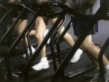 Low Section View of People Running on Treadmills in a Gym
