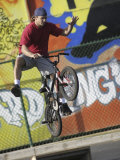 Buy Bicyclist Coming Off a Ramp at AllPosters.com
