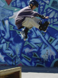 Boy in Rollerblades Jumping
