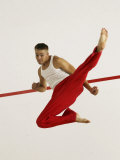 Young Man Kicking While Practicing Karate