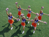 High Angle View of a Group of Cheerleaders Cheering in a Field