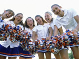 Portrait of a Group of Cheerleaders Holding Pom-Poms
