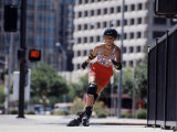 Woman on Rollerblades Coming Around a Corner