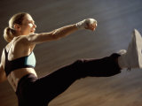 Buy Side Profile of a Young Woman Kickboxing at AllPosters.com