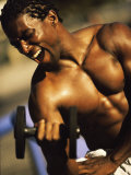 Buy Young Man Exercising with a Dumbbell at AllPosters.com