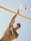 Buy Low Angle View of a Young Man Playing Volleyball at AllPosters.com