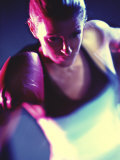 Close-up of a Young Woman Wearing Boxing Gloves