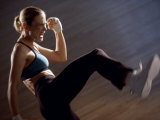 Side Profile of a Young Woman Kickboxing