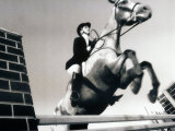 Buy Low Angle View of a Jockey And a Horse Jumping Over a Hurdle at AllPosters.com