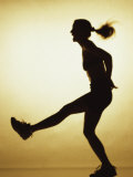 Buy Silhouette of a Young Woman Exercising at AllPosters.com