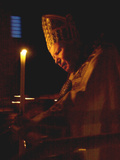 Buy Pope John Paul II Prays Before a Candle at the Beginning of an Holy Easter Vigil Mass at AllPosters.com