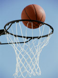 Close-up of a Basketball on the Edge of a Hoop