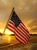 A Flag Waves Over Pearl Harbor as Dawn Breaks