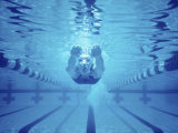 Young Woman Swimming Underwater