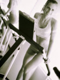 Buy Young Woman Running on a Treadmill at AllPosters.com