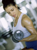 Buy Young Woman Exercising with Dumbbells at AllPosters.com