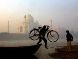 Buy An Unidentified Cyclist Gets Down with His Cycle against the Backdrop of the Taj Mahal at AllPosters.com