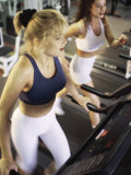 Buy High Angle View of Two Young Women Running on Treadmills in a Gym at AllPosters.com