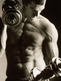 Buy Close-up of a Young Man Working Out with Dumbbells at AllPosters.com