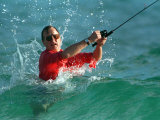 Waves Splash President-Elect George Bush as He Casts a Line While Surf-Fishing