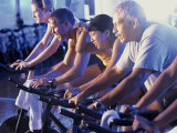 Group of People Exercising in a Gym