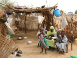 Buy A Sudanese Family is Seen Inside Their Thatched Hut During the Visit of Unicef Goodwill Ambassador at AllPosters.com
