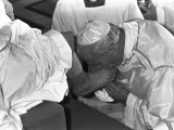 Buy Pope John Paul II Kisses the Feet of One of 12 Mentally Retarded Italians at AllPosters.com