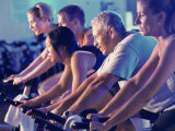 Buy Group of People on Exercise Bikes in a Health Club at AllPosters.com