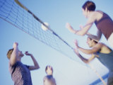 Buy Low Angle View of Two Young Couples Playing Beach Volleyball at AllPosters.com