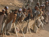 A Group of Afghan Construction Daily Workers Wait to be Hired