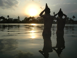 Hindu Devotees Offer Prayers to the Sun God at Sunset