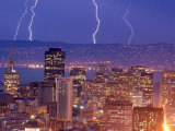 With the San Francisco Skyline in the Foreground, Lightning Strikes Over the Hills of Oakland, Ca