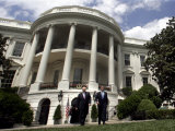President Bush, Right, and Vice President Dick Cheney Walk to the South Lawn