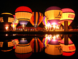 People Watch Hot Air Balloons as They Reflect off the Barigui Lake