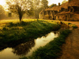 Morning Mist on Rack Isle Outside Weavers' Cottages, Arlington Row, Bibury, United Kingdom Photographic Print