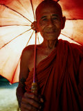 Buy Smiling Monk Holding Umbrella, Mrauk U, Myanmar (Burma) at AllPosters.com