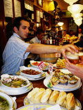 Pinxtos (Tapas) on Counter of Busy Ormazabal Taberna Bar, San Sebastian, Spain