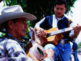 Men Strumming Guitars in Parque Libertad, San Salvador, El Salvador