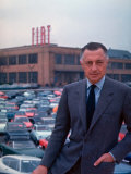 Buy President of Fiat Gianni Agnelli Standing with Cars and Fiat Factory in Background at AllPosters.com