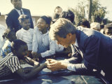 Presidential Contender Bobby Kennedy Stops During Campaigning to Shake Hands African American Boy