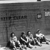 Workers Sitting Against Wall During Lunch Break, at Vega Aircraft Plant, During WWII: Burbank, Ca